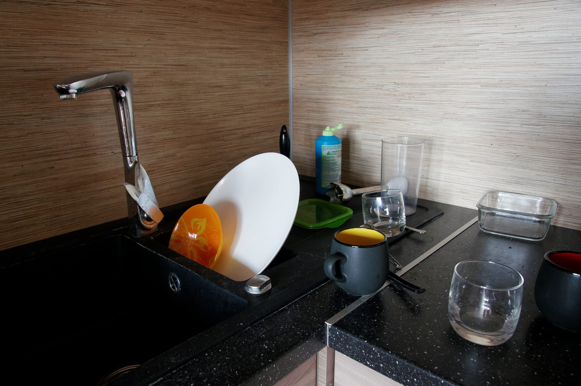 A kitchen sink and counter, shown in full