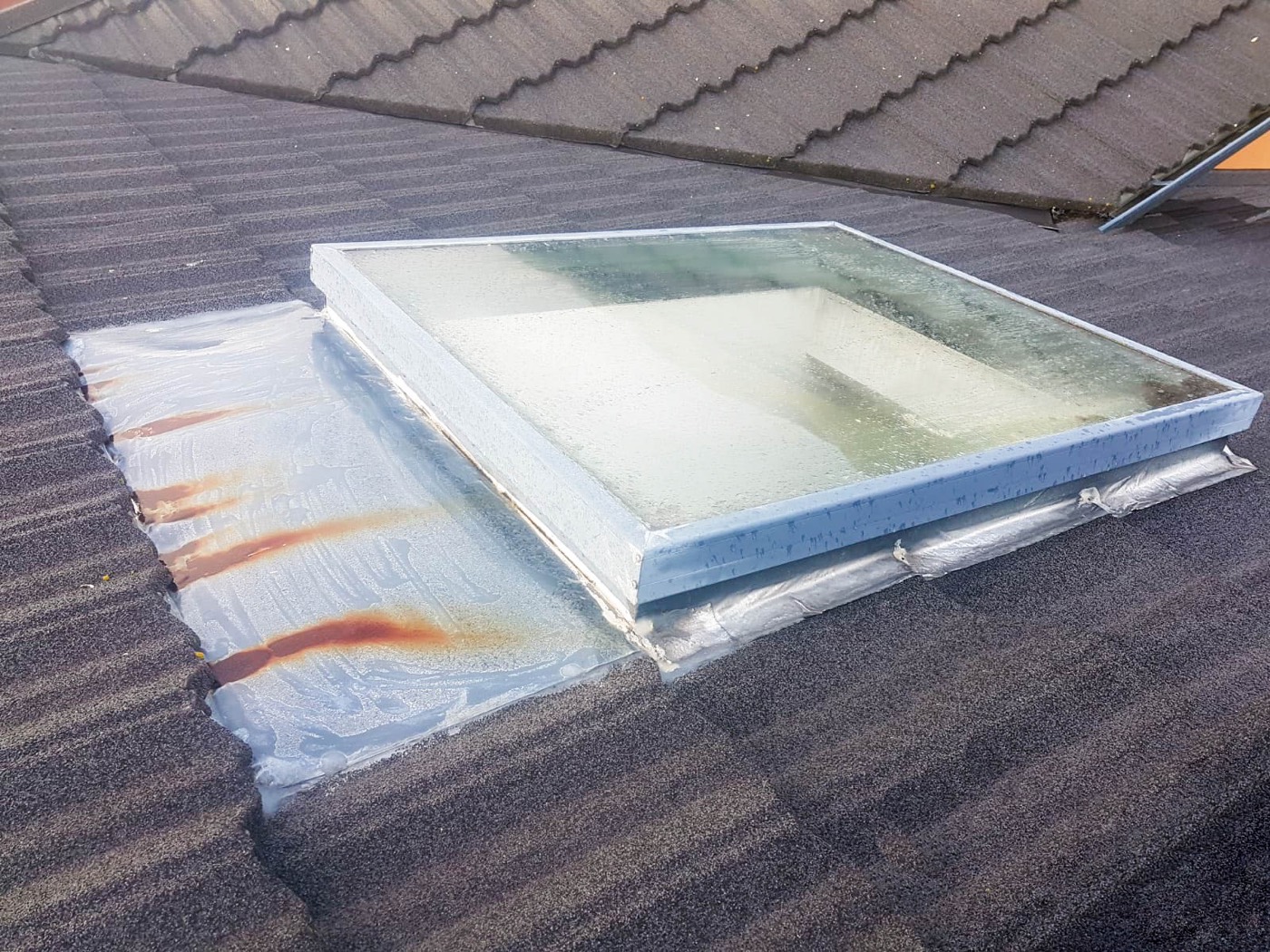 A skylight set into a low-slope roof